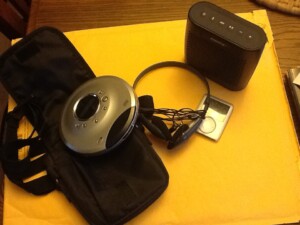 walkman cd player and earphones and ipod and bluetooth speaker